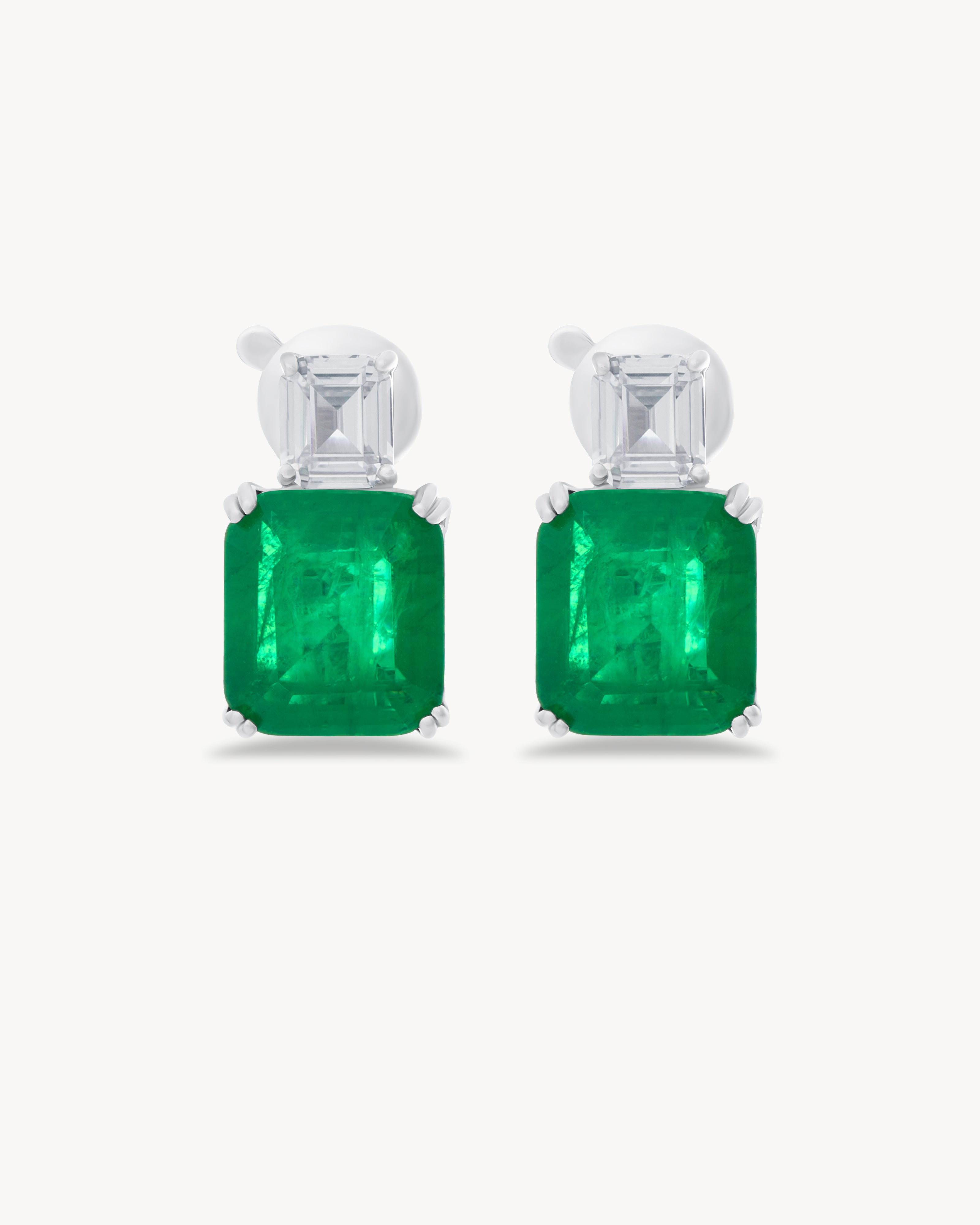 Earrings with emerald cut green stones