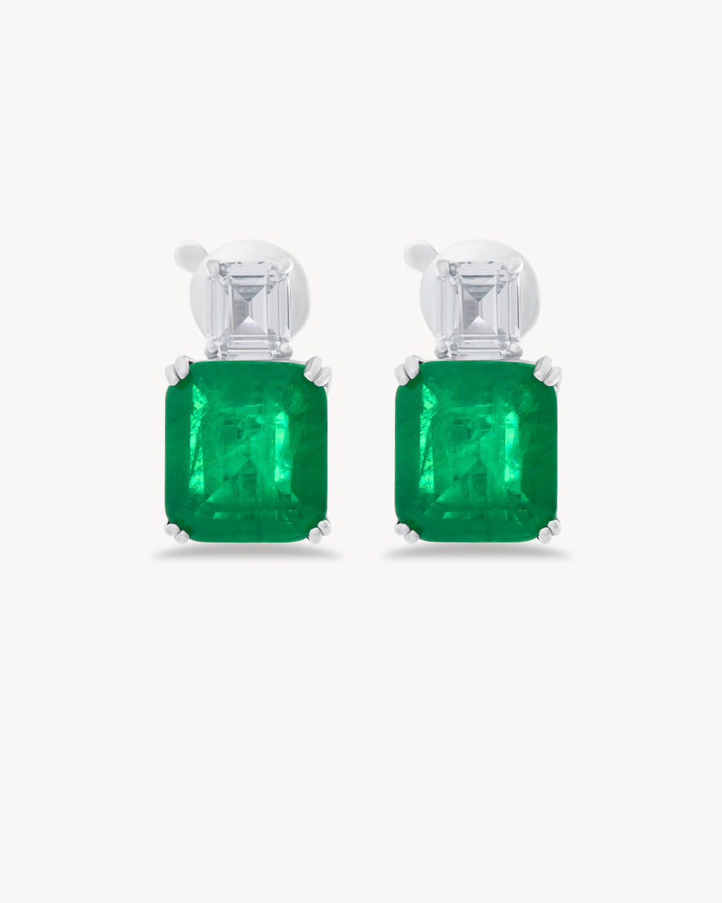 Earrings with emerald cut green stones