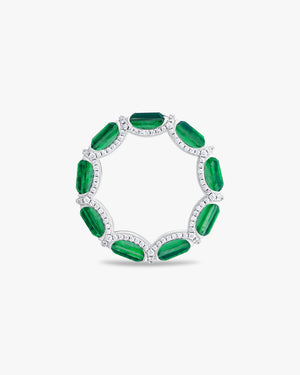 Ring with emerald cut green stones