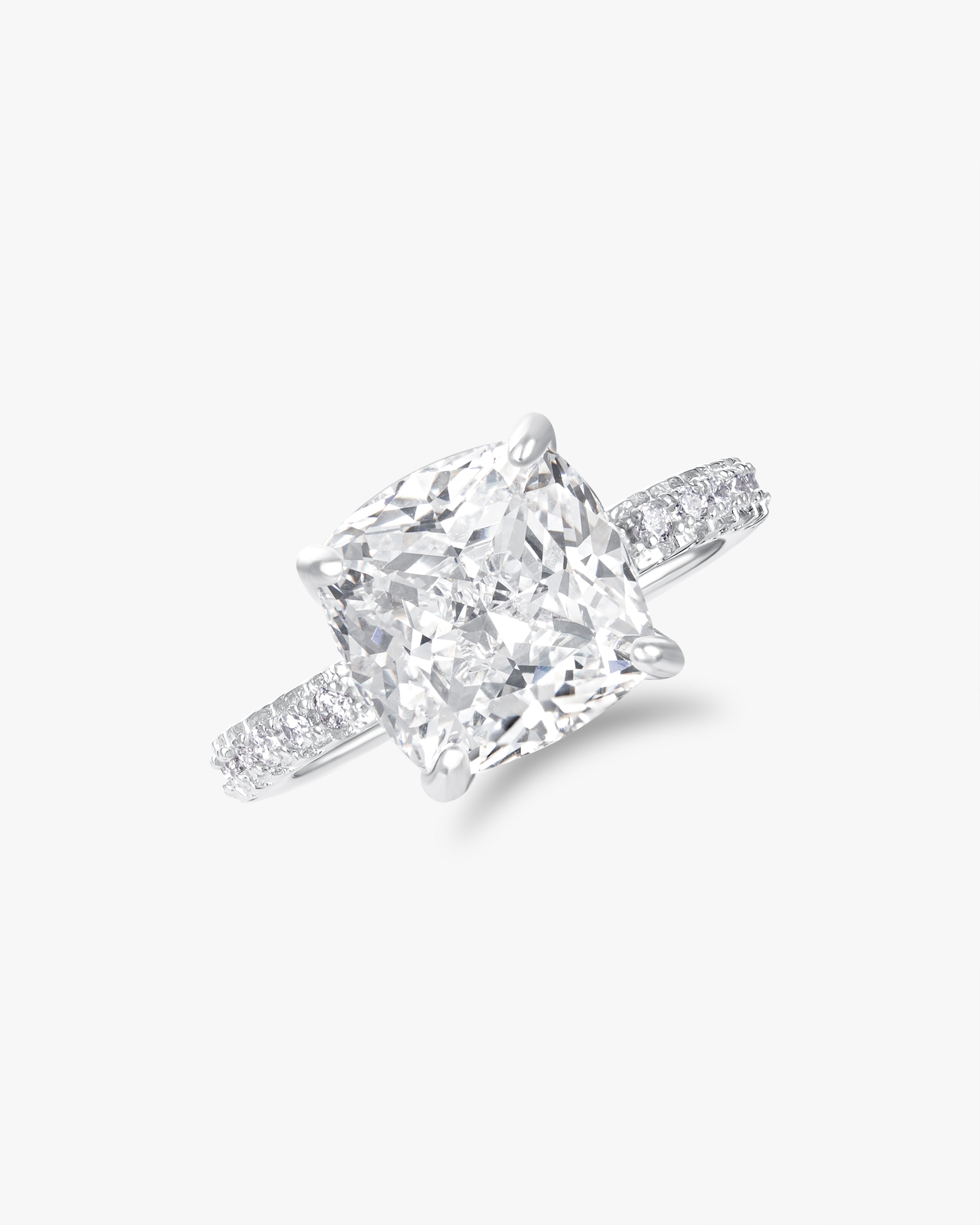 Cushion cut solitaire ring with pavé band