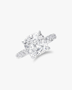 Cushion cut solitaire ring with pavé band
