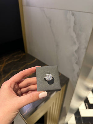 Ring with cushion cut white stone