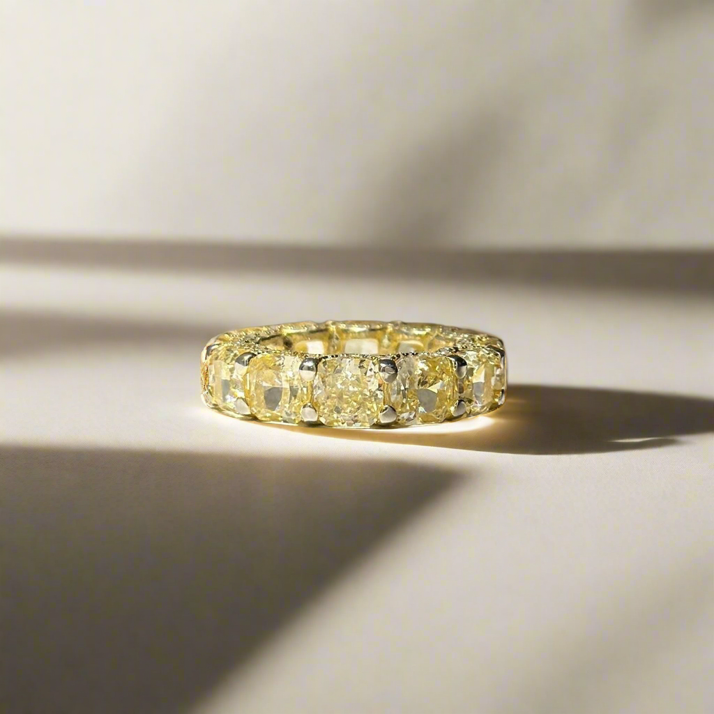 Ring with cushion cut yellow stones
