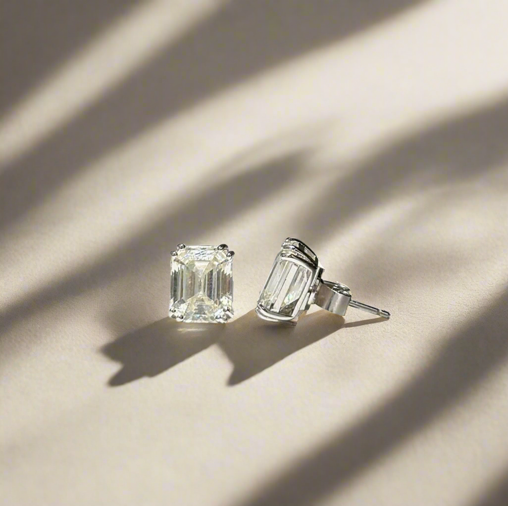 Earrings with emerald cut white stones