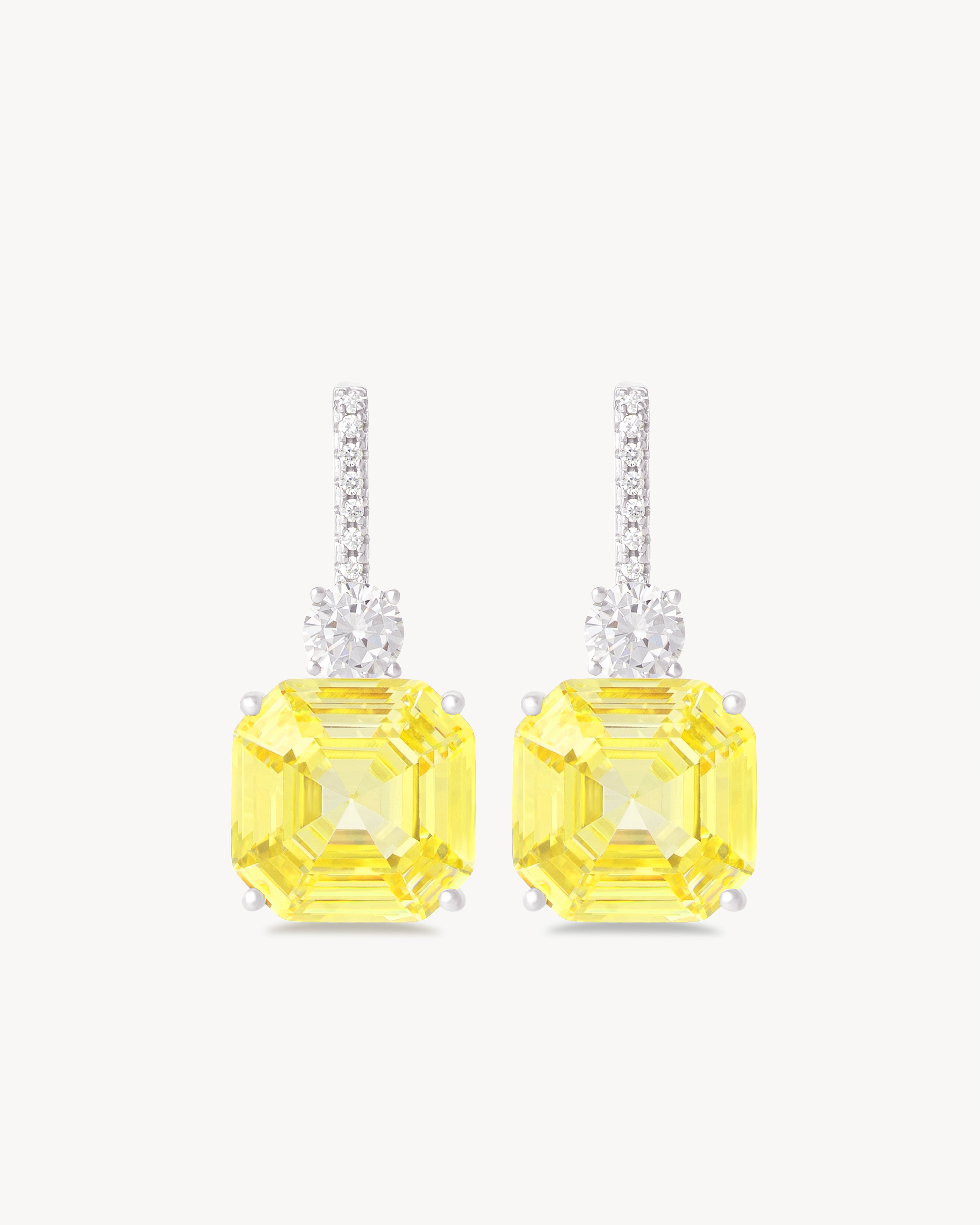 Earrings with fancy yellow asscher cut stones