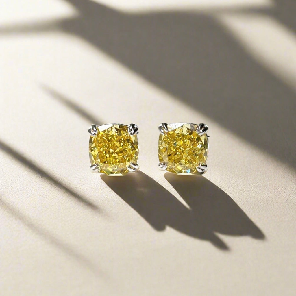 Earrings with cushion cut yellow stones