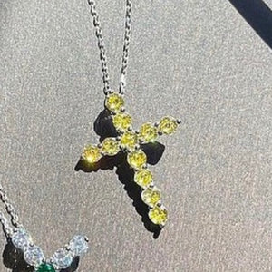 Pendant cross with round cut yellow stones