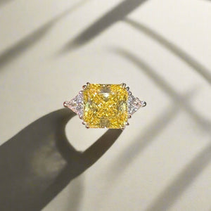 Ring with princess cut yellow stone
